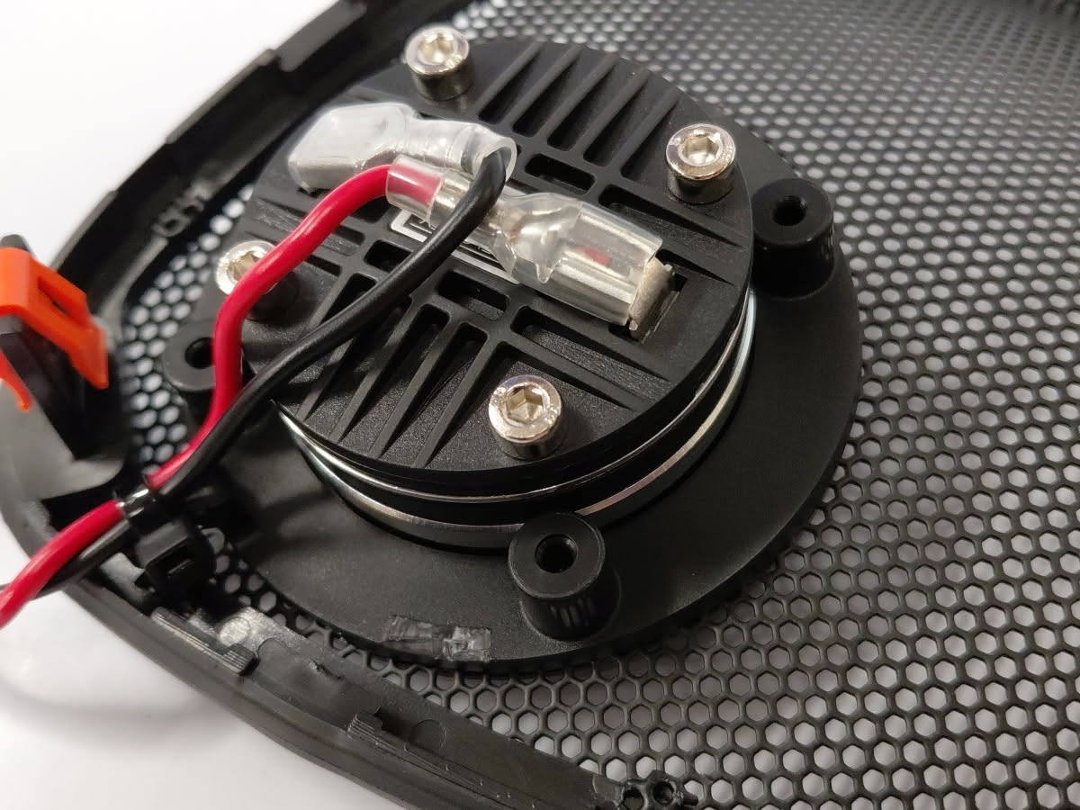 Close view of the zip-tie tab used to secure the RZ75H speaker wires