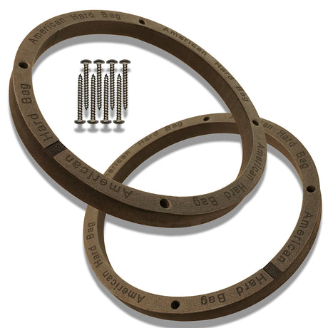 Two black EVA speaker spacers with a bolt pattern and several screws placed next to them for Harley lower fairing speakers.