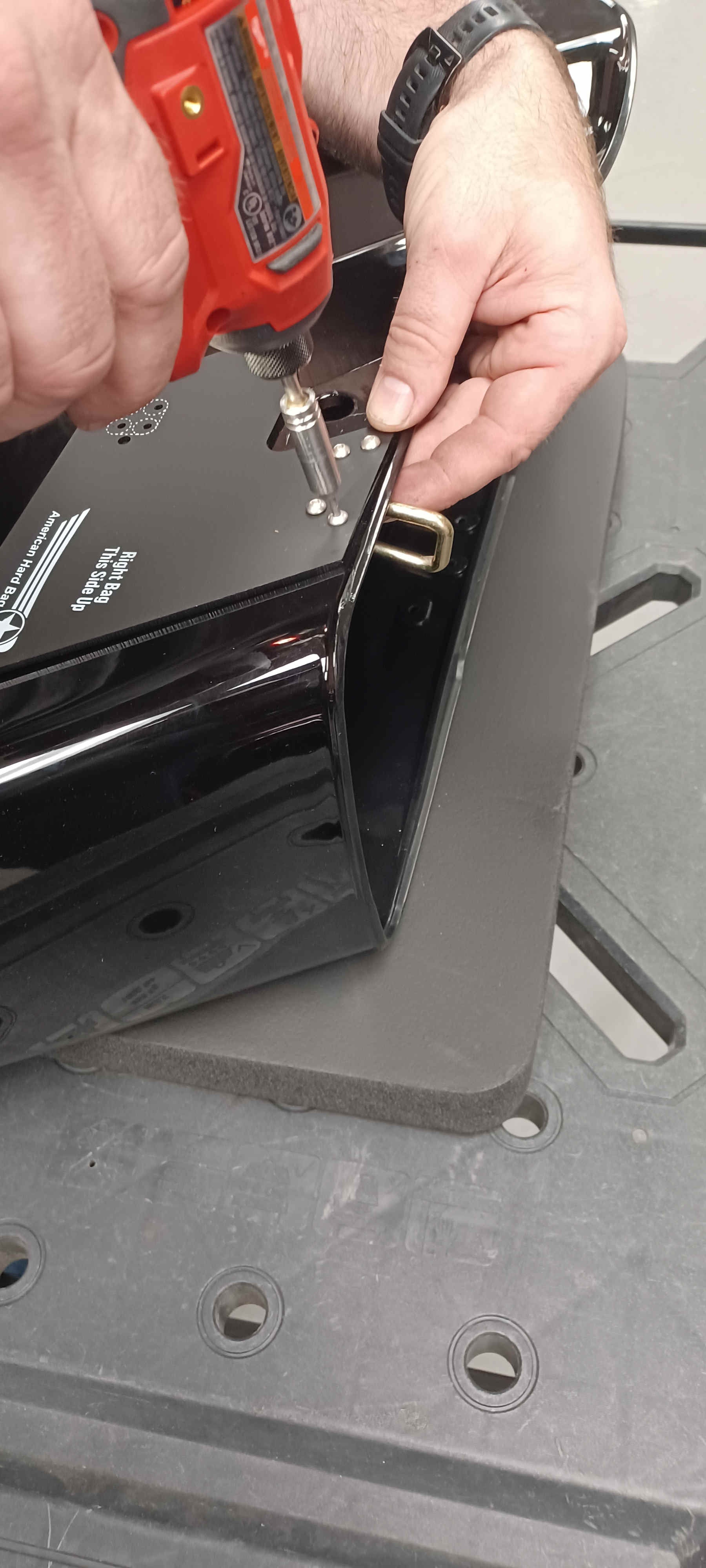 Template attached to the right bag using the factory latch bar screws