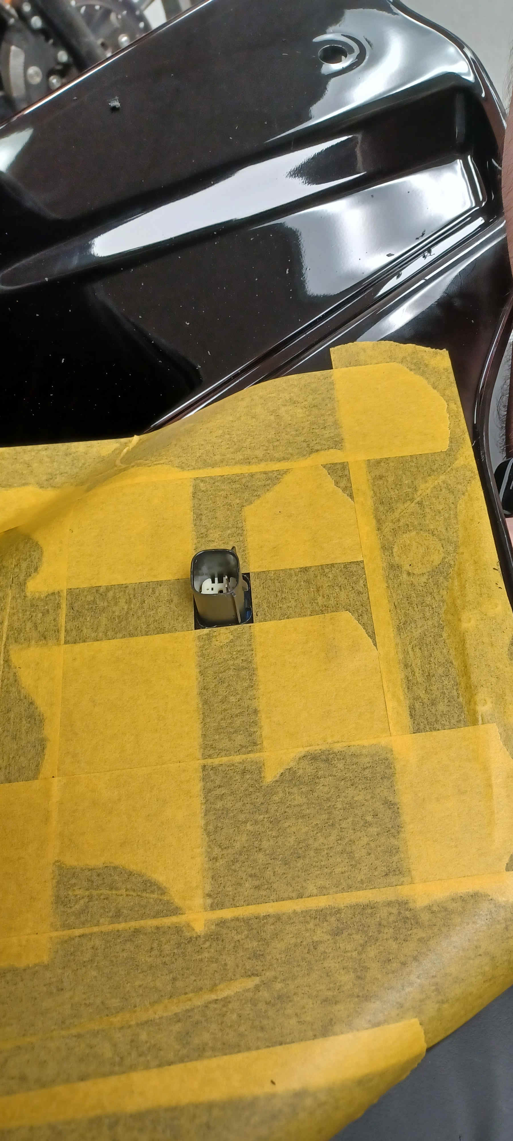 Installed bag-side plug sitting flush in the opening